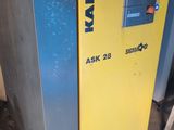 a machine that is sitting on the ground in front of a building