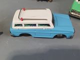 three toy cars that are sitting on a table