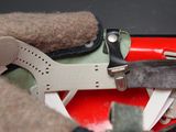 a red suitcase with a pair of scissors and a pair of scissors