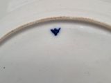 a white plate with a blue heart on it