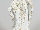 an image of a statue of a woman in a white dress