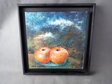 tableau représentant deux oranges dans un bol bleu posé sur une table