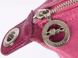 pink leather purse with a metal zipper and a horse emblem on it