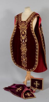 an image of a red and gold dress on a mannequin stand