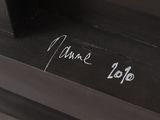 a close up of a piece of wood with writing on it