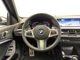 the interior of a bmw car with a steering wheel and dashboard