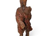 an image of a sculpture of a man holding a baby