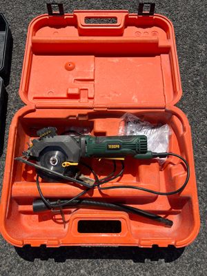 a tool in a case with a cord and a tool in it