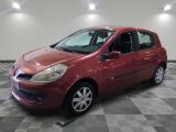a picture of a red car that is parked in a garage