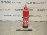 a red fire extinguisor sitting on a table