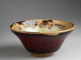 a close up of a bowl on a table with a gray background