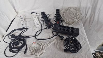 a lot of wires and cords that are on a table