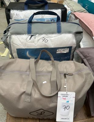 many bags of luggage sitting on a table in a store