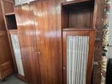 a room with a lot of cupboards and a window