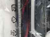 a black and red cord in a plastic bag