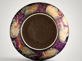 a purple and yellow bowl with a black rim