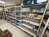 many shelves in the store that have various items on them