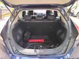 a trunk of a car with a laptop in it