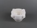 a white cup that is sitting on a table