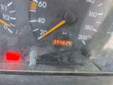 a close up of a car ' s dashboard with a speedometer