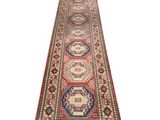 a red and blue runner rug on a white background