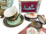many different types of tea cups and saucers on the table