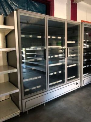 many empty shelves in a store with empty shelves