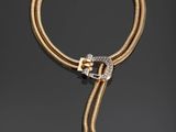 un collier en or et diamants avec un fermoir en forme de serpent