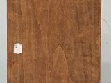 an old wooden box sitting on top of a table next to a white wall