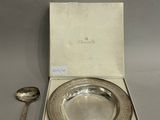 silver plate with spoon and spoon rest in a box