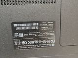 a close up of a laptop with a barcode on it