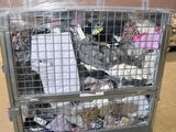 a large metal cart with a lot of trash inside of it