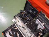 a laptop and other electronics on the floor of a room