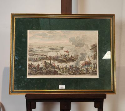 tableau encadré représentant une scène de bataille, avec un homme à cheval au premier plan