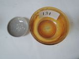 a small bowl with a number on it next to a small bowl with a number on it
