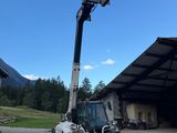 a forklift that is parked in front of a building