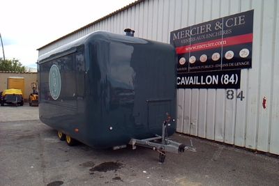 an image of a trailer parked in front of a building