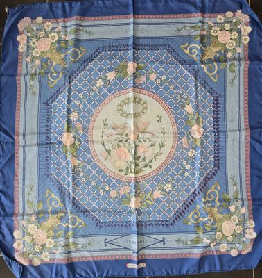 a blue and pink silk table cloth with a floral design