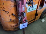 a forklift with a seat on top of it in a warehouse
