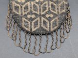an image of a beaded purse with chains on it