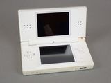 a white nintendo wii game console sitting on a table