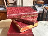 three books stacked on top of each other on a table