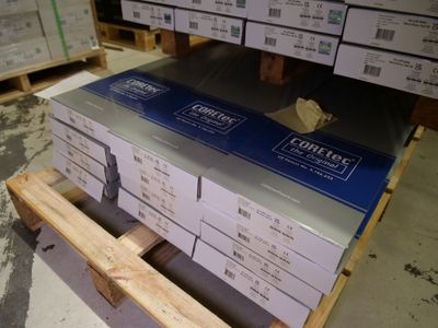 a stack of boxes sitting on a pallet in a warehouse