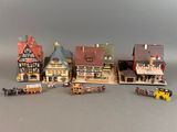 tout un tas de bâtiments miniatures posés sur une table