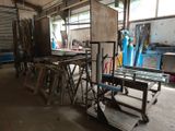 many pieces of wood sitting on a cart in a building