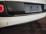 a white car that is parked in a garage