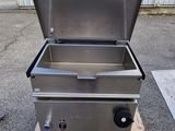 an image of a stainless steel grill sitting on top of a wooden pallet
