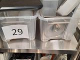 many containers that are on the shelf in the kitchen