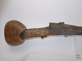 an old wooden gun with a wooden handle