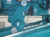 a close up of a machine that is working on a piece of machinery